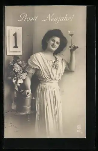 Foto-AK L.J. & F.F. Nr. 4235 /2: Frau mit Sektglas am Kalender, Neujahrsgruss