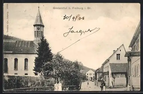 AK Güntersthal /Freiburg, Strassenpartie mit Kirche