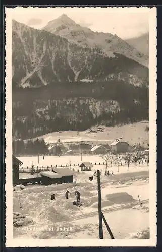 AK Mauthen, Ortsansicht mit Polinik im Schnee