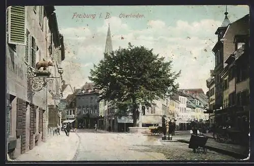 AK Freiburg / Breisgau, Oberlindenstrasse mit Gasthäusern und Geschäften