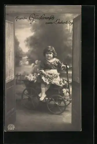 Foto-AK R & K / L Nr. 8749 /2: Mädchen auf einem Leiterwagen mit Blumen