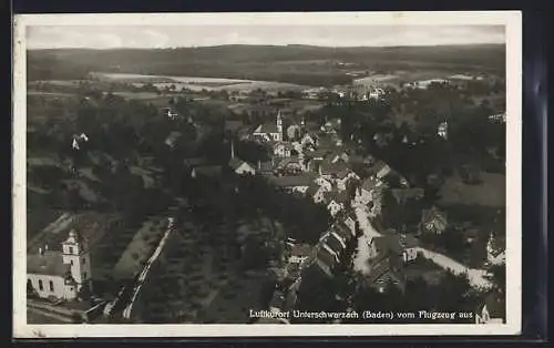 AK Unterschwarzach /Baden, Teilansicht mit Kirche, Fliegeraufnahme