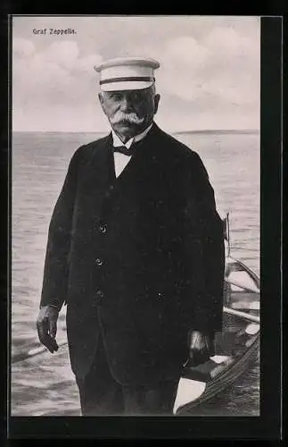AK Graf Zeppelin mit Schirmmütze und einem Boot am Ufer