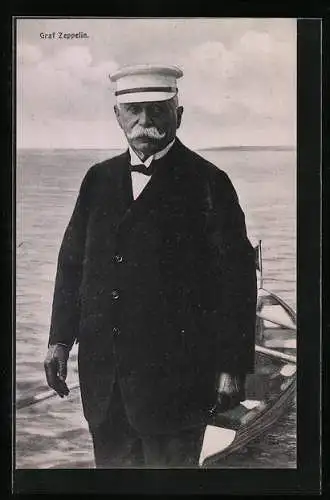 AK Graf Zeppelin mit Schirmmütze und einem Boot am Ufer