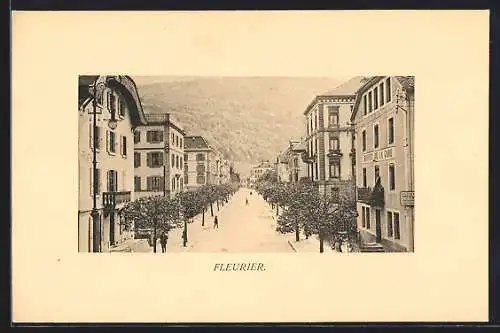 AK Fleurier, Strassenpartie mit Hotel-Pension B. de la Gare