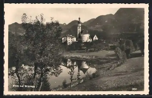 AK Reith bei Brixlegg, Ortspartie mit Teich und Kirche