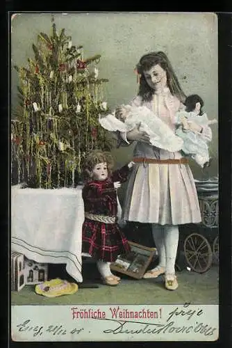 AK Mädchen mit drei Puppen unterm Weihnachtsbaum