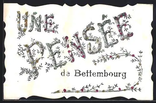 AK Bettembourg, Der Schriftzug Une Pensée in floralem Font, mit Glitzersteinchen