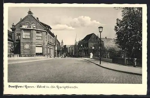 AK Nordhorn /Hann., Blick in die Hauptstrasse von der Brücke aus, mit Kirche