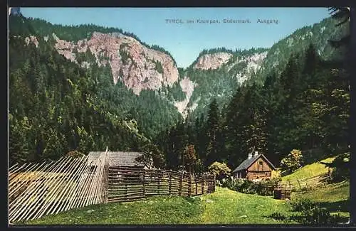 AK Tirol, Holzhäuser und Blick auf Felswände