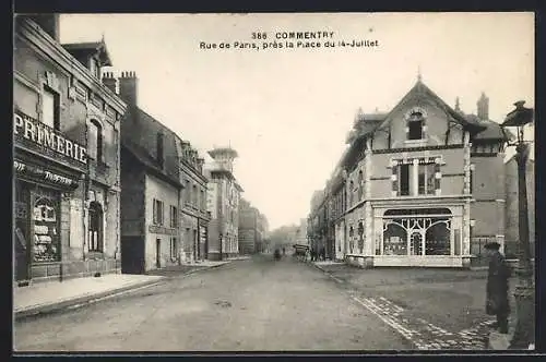 AK Commentry, Rue de Paris, près la Place du 14-Juillet