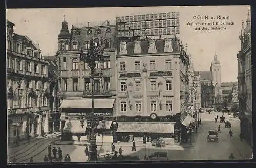 AK Köln a. Rhein, Strasseneck am Wallrafplatz mit Geschäften, Im Hintergrund Jesuitenkirche