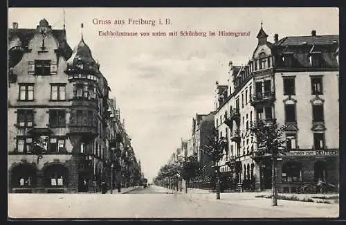 AK Freiburg i. B., Eschholzstrasse von unten mit Restaurant und Schönberg im Hintergrund