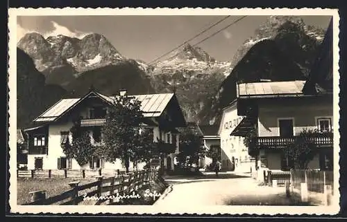 AK Lofer, Ortspartie mit Blick in die Alpen