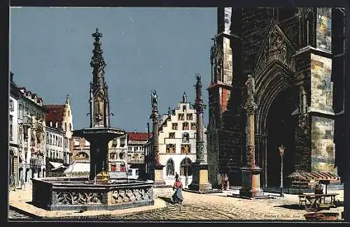 Künstler-AK Eugen Felle: Freiburg / Breisgau, Das Portal der Münsterkirche, Kornhaus im Hintergrund