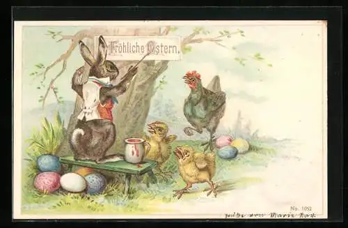 AK Osterhase schreibt Ostergruss auf ein Schild