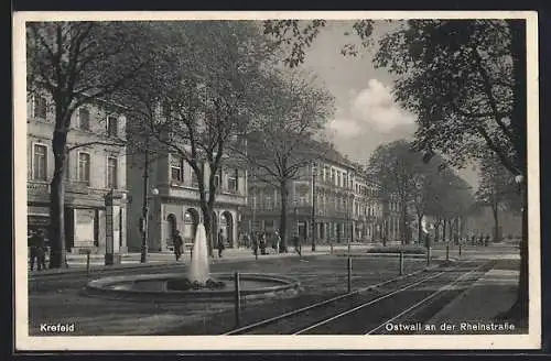 AK Krefeld, Ostwall an der Rheinstrasse mit Springbrunnen