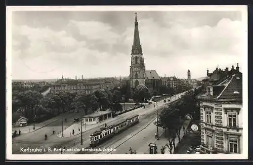 AK Karlsruhe i. B., Partie bei der Bernharduskirche mit Strassenbahn