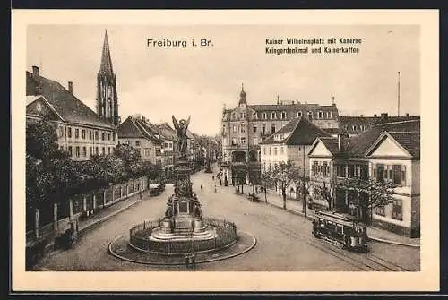 AK Freiburg i. B., Kaiser Wilhelmsplatz mit Kaserne und Kriegerdenkmal, Strassenbahn