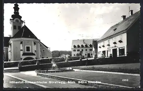 AK Strallegg /Stmk., Strassenpartie mit Geschäft und Kirche