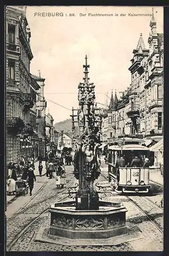 AK Freiburg i. Br., Strassenbahn am Gotischen Brunnen in der Kaiserstrasse