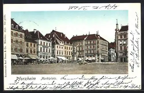 Goldfenster-AK Pforzheim, Marktplatz mit leuchtenden Fenstern