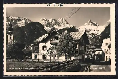 AK Lofer, Strassenpartie mit Bergpanorama