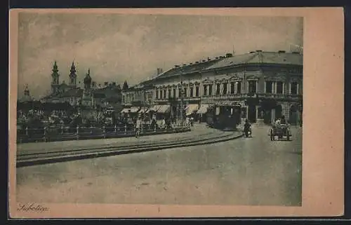 AK Subotica, Strassenpartie mit Kirche und Strassenbahn