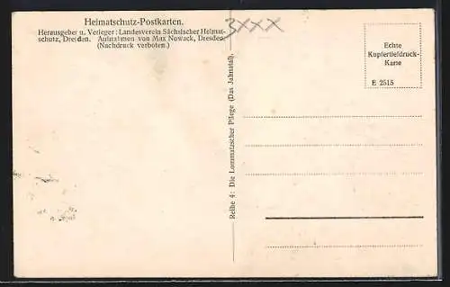 AK Hohenwussen, Blick auf den Ort von einem Getreidefeld mit Garben