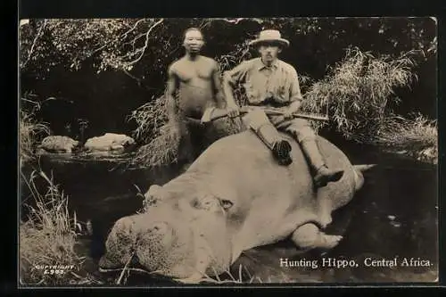 AK Colonialist and indigenous man with a killed Hippo