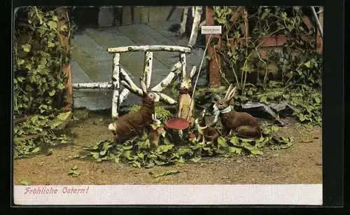 AK Osterhasenfamilie sitzt um einen Pilz herum