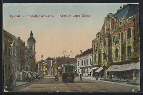 AK Kossuth, Lajos Gasse mit Strassenbahn und Geschäften, Turm