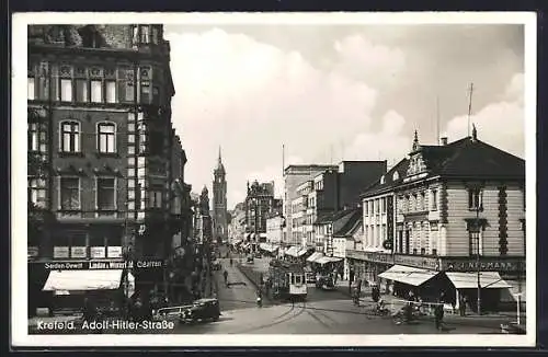 AK Krefeld, Strasse mit Strassenbahn und Handlung von J. Neumann