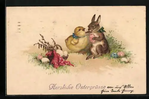 AK Osterhase und Osterküken mit bunten Ostereiern auf einer Wiese