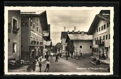 AK Taxenbach im Pinzgau, Strassenpartie mit Eisenwaren-Geschäft von Wilhelm Dick