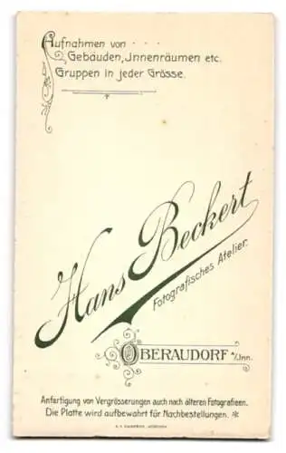Fotografie H. Beckert, Oberaudorf a. Inn, Eisenbahner in Uniform mit Mustach