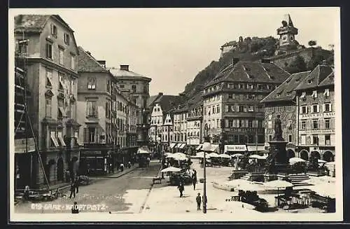 AK Graz, Hauptplatz mit Geschäften und Denkmal