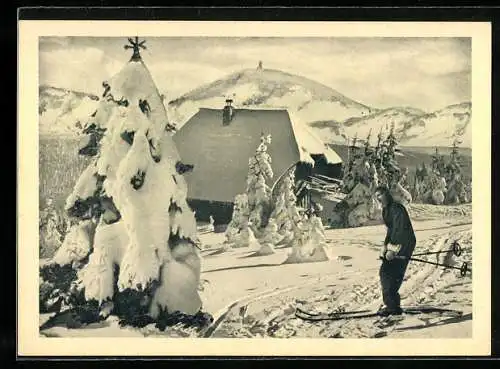 AK Skifahrerin an einer Berghütte