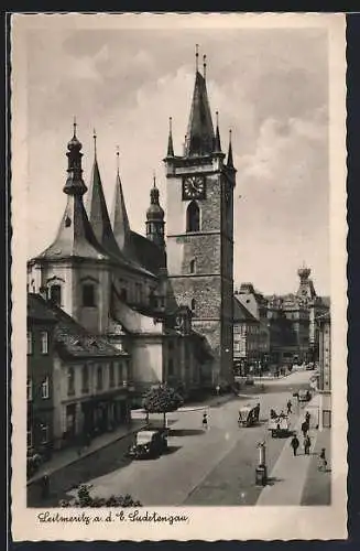 AK Leitmeritz / Litomerice, Ansicht einer Kirche an einer Strasse mit Autos