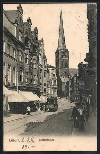 AK Lübeck, Breitestrasse mit Geschäften, Kirche und Strassenbahn