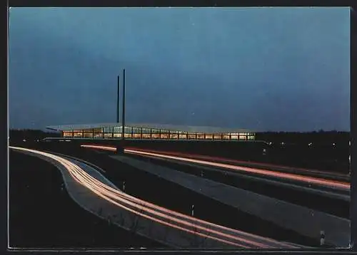 AK Nellinghof-Schierberg, Autobahn-Brückenrasthaus Dammer Berge am Abend