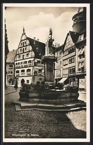 AK Kitzingen a. Main, Strassenpartie mit Kaiser`s Kaffeegeschäft und Brunnen