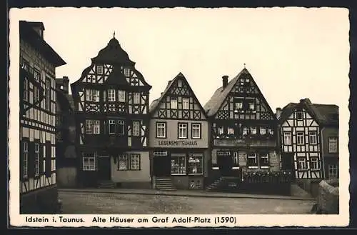 AK Idstein i. Taunus, Alte Häuser am Graf Adolf-Platz mit Lebensmittelgeschäft