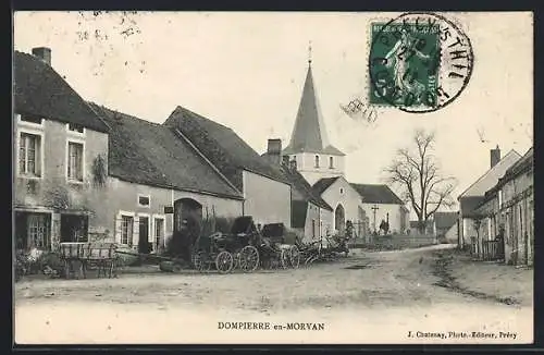 AK Dompierre-en-Morvan, vue du village avec église et charrettes