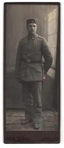 Fotografie Wilh. Köhler, Posen, Soldat in Feldgrau Uniform Rgt. 12 mit Bajonett und Portepee