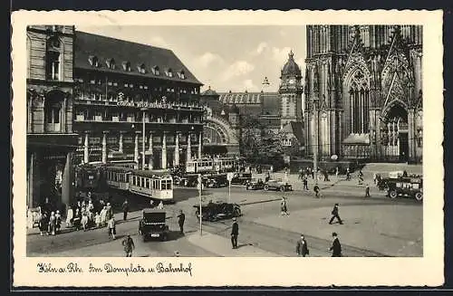 AK Köln am Rhein, Strassenbahn am Domplatz und Bahnhof