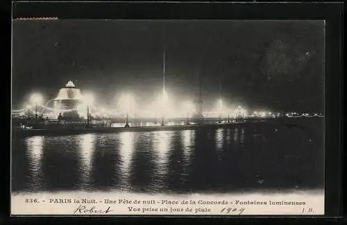 AK Paris, Un Fete de nuit, Place de la Concorde, Fontaines illumineuses, Vue prise un jour de pluie