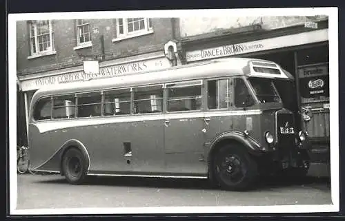 Foto-AK Bus mit Kennzeichen EUF 504, 185 BA hält vor Geschäften