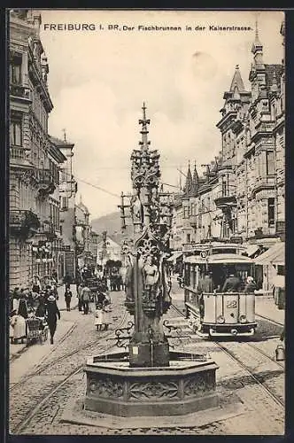 AK Freiburg i. Br., Der Fischbrunnen in der Kaiserstrasse mit Strassenbahn