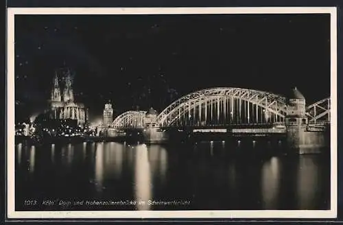 AK Köln, Dom und Hohenzollernbrücke im Scheinwerferlicht